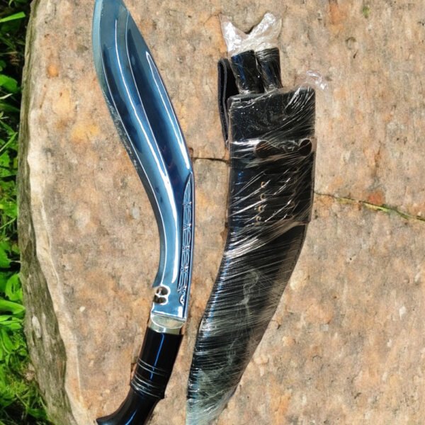 Indian Mutiny Officer Kukri placed on a stone, the blade is 13.5 inches long and it has a buffalo horn handle