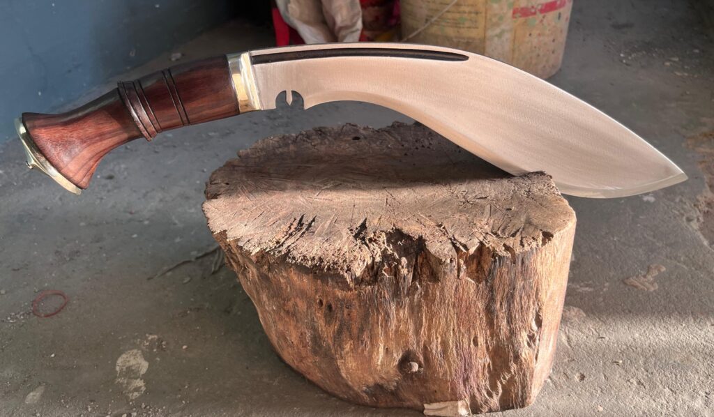 Chopping wood through Bhojpure Kukri knife  Himalayan Imports